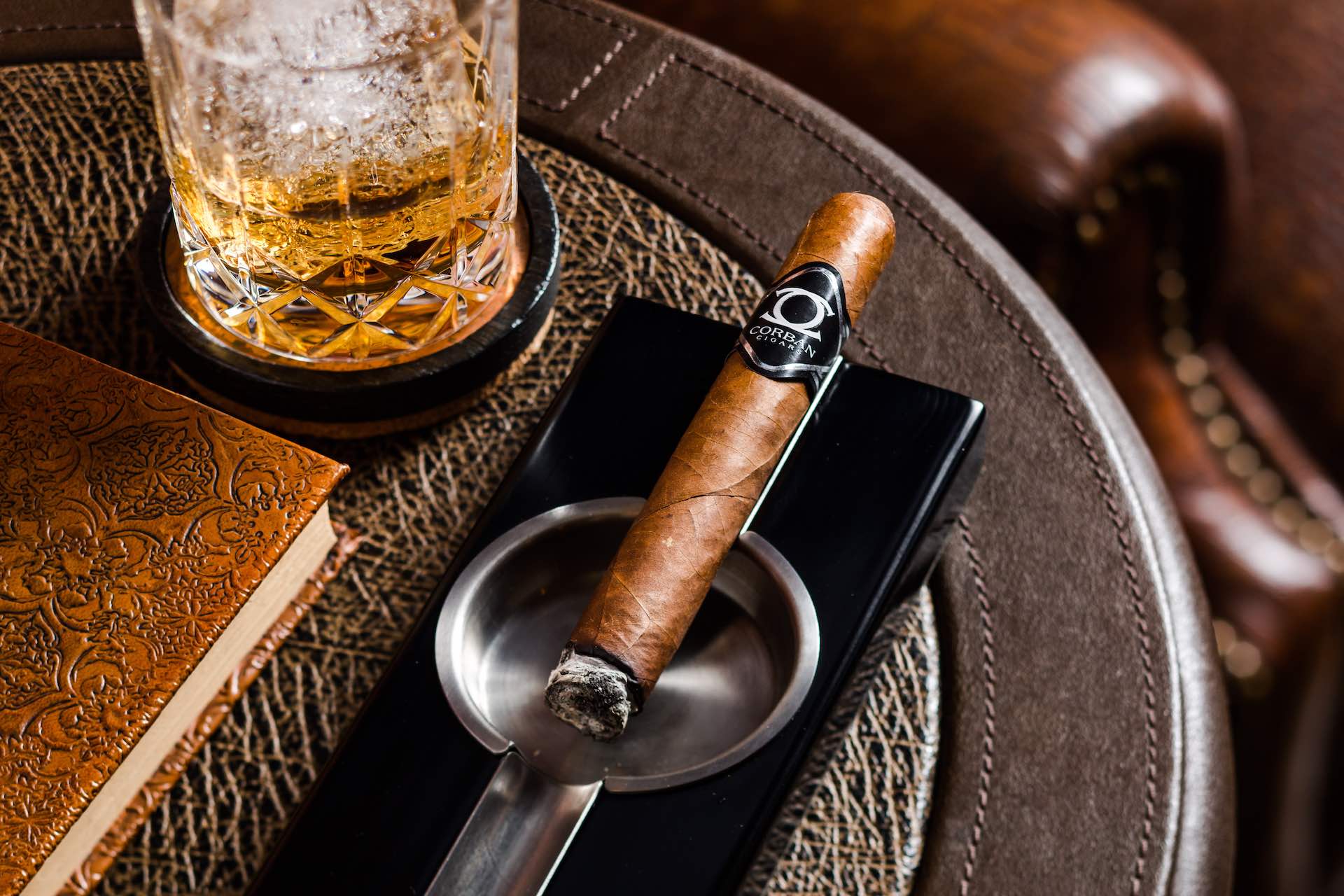 Corban Cigar with glass of scotch